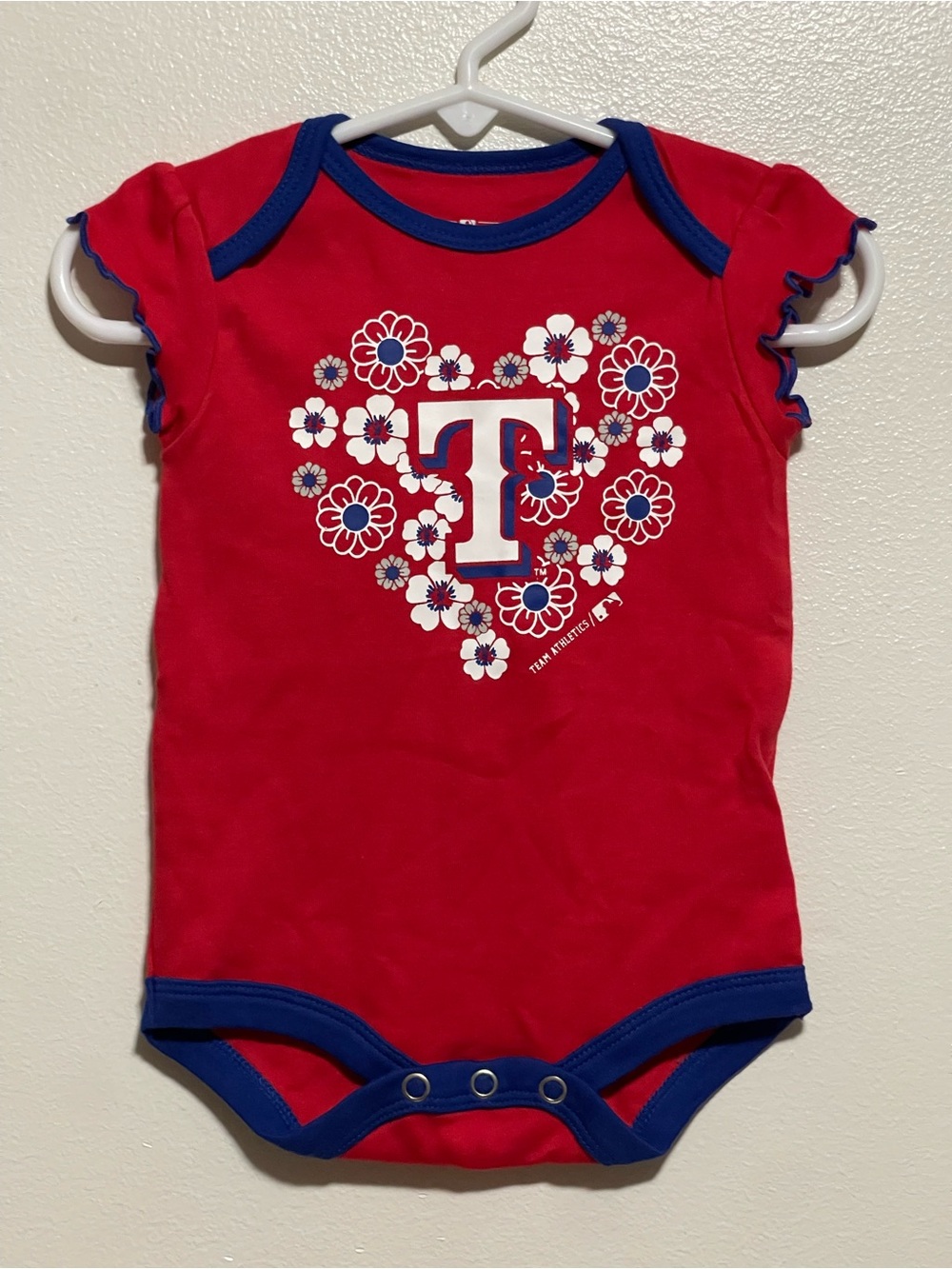 Red Floral 'T' Logo Baby One-Piece with Blue Trim